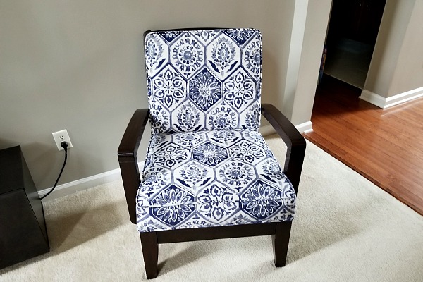 Instead of buying new furniture, I had two chairs reupholstered and two throw pillows made out of the same fabric for the couch. It gave our living room a fresh new look for a fraction of the cost.